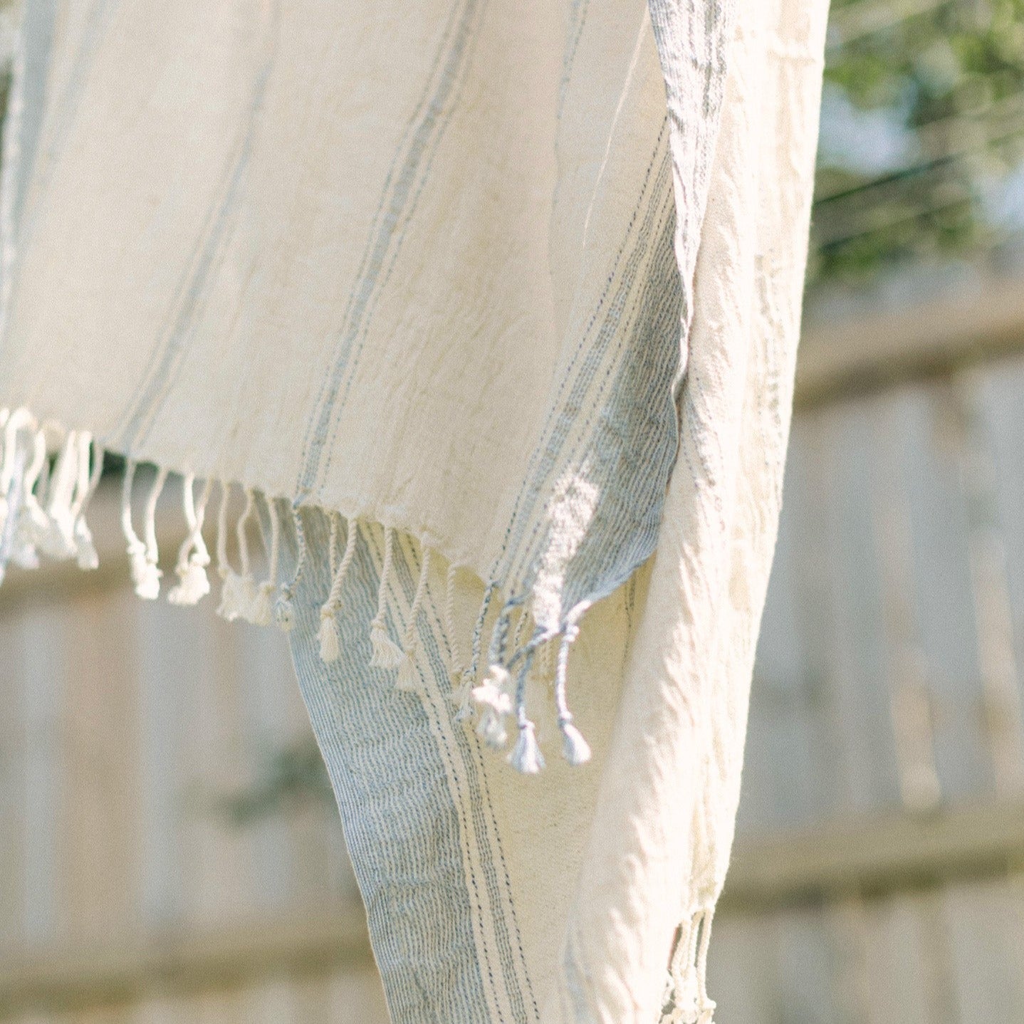 Ila handwoven shawl with tassels.