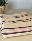 Handwoven, soft cotton Turkish towel with pink stripes.
