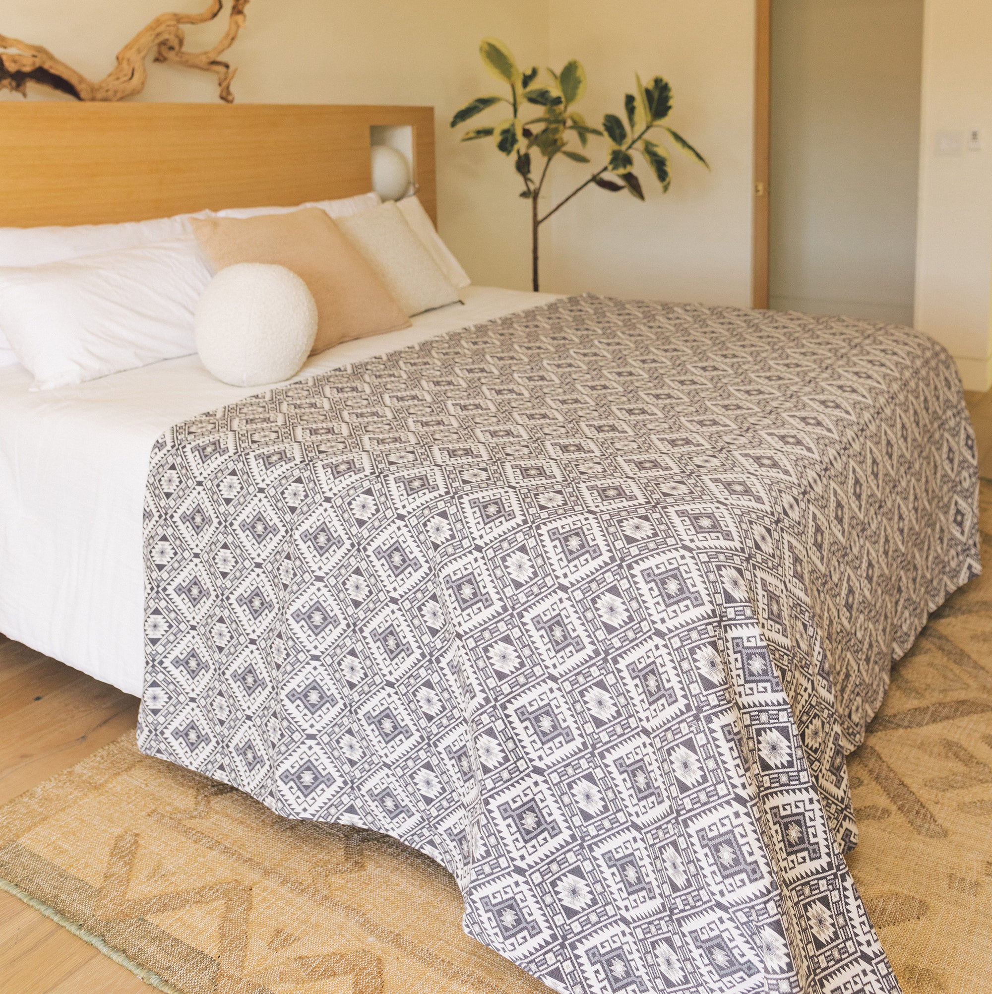 Kilim pattern handwoven blanket as a bed cover.