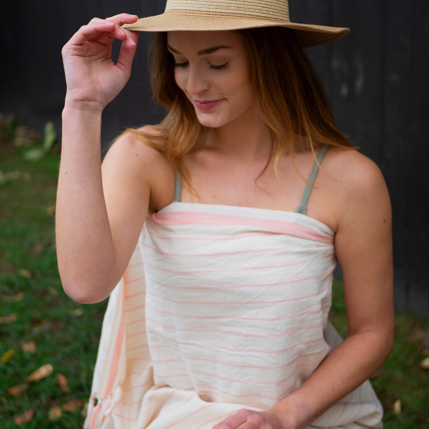 Light coral and beige Turkish towel as a beach cover-up.