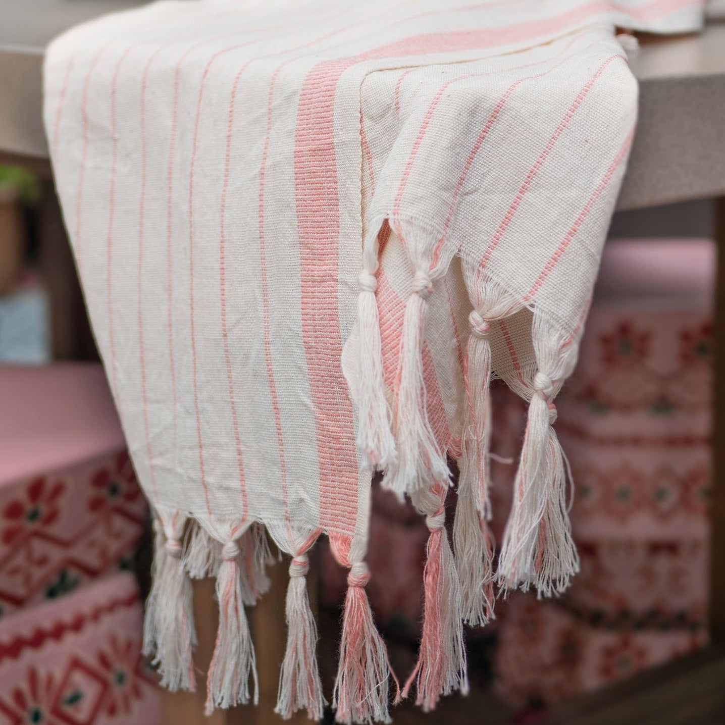 Cotton Turkish towel with light coral stripes.