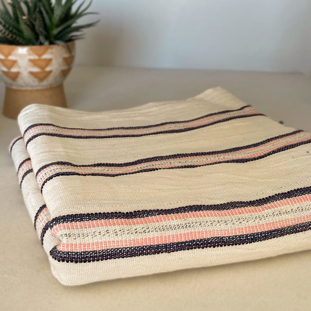Handwoven, soft cotton Turkish towel with pink stripes.