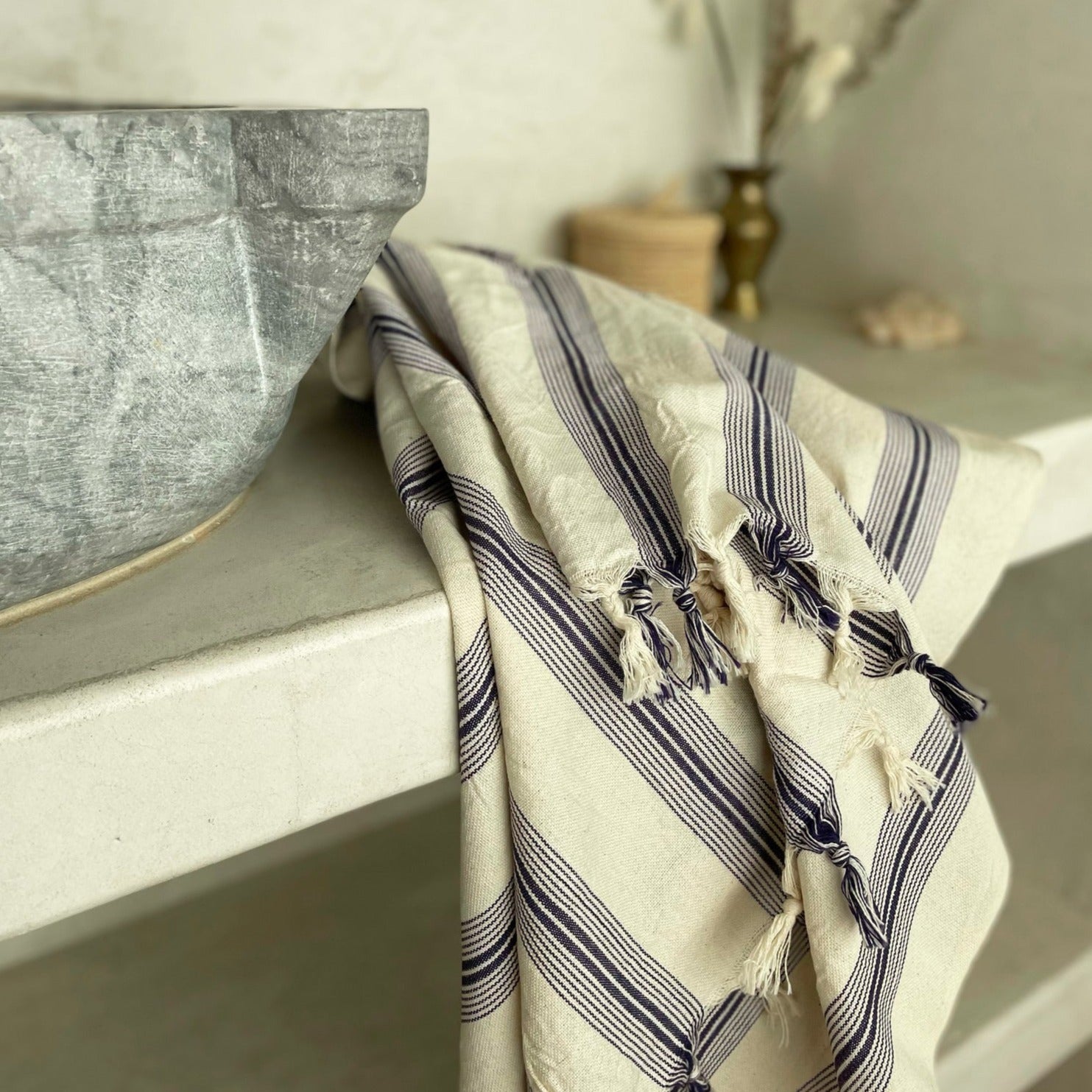 Cotton Turkish towel with purple stripes and tassels.